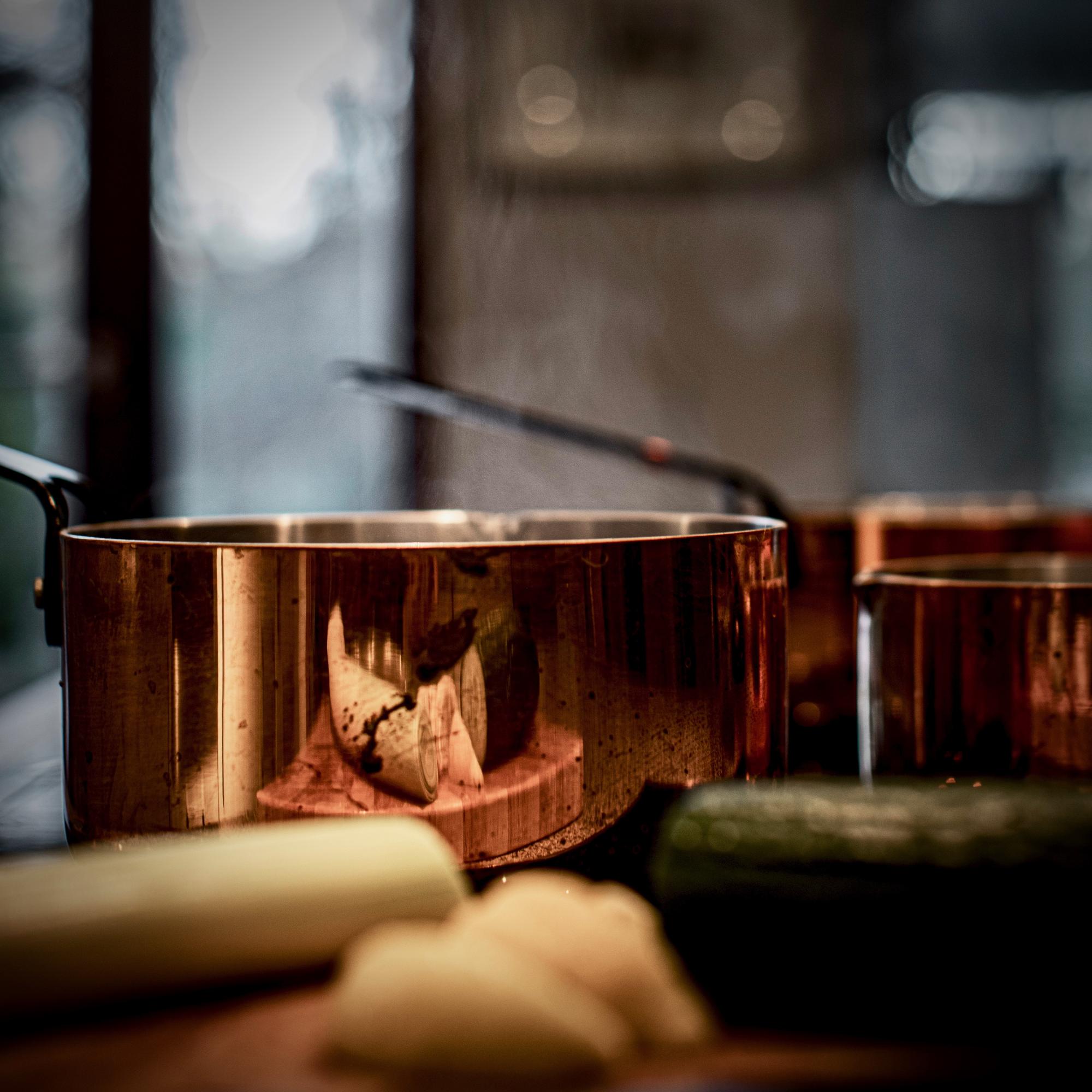 Intimate workshop kitchen with copper pans